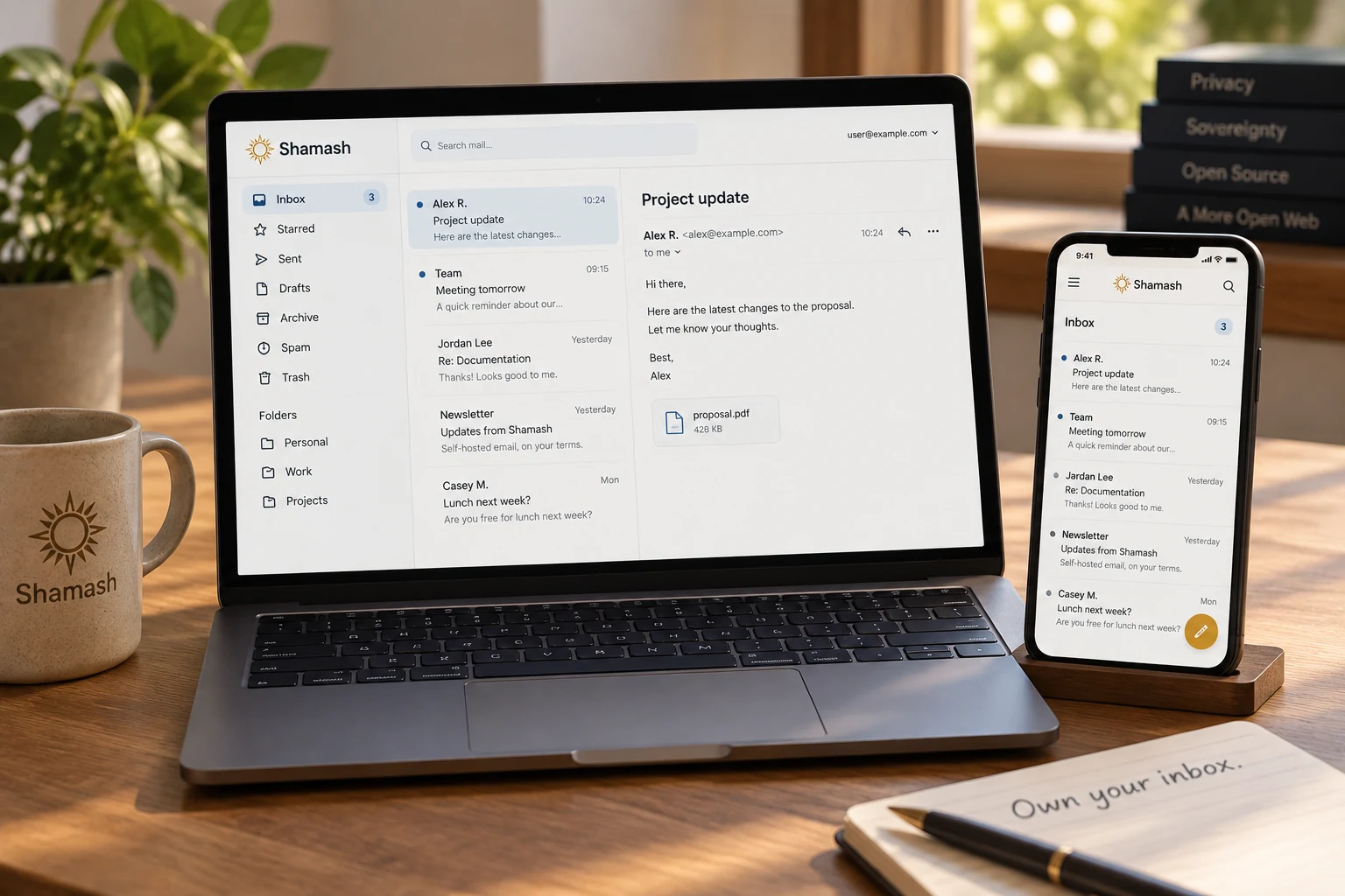 Illustrative Shamash webmail shown on a laptop and a phone.